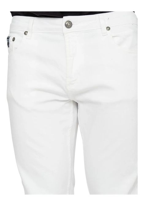 JEANS WITH LOGO PATCH VERSACE JEANS COUTURE | Trousers | 78GAB5D0 CEWR1003